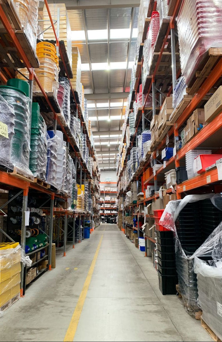 Warehouse interior with shelves stocked with various items